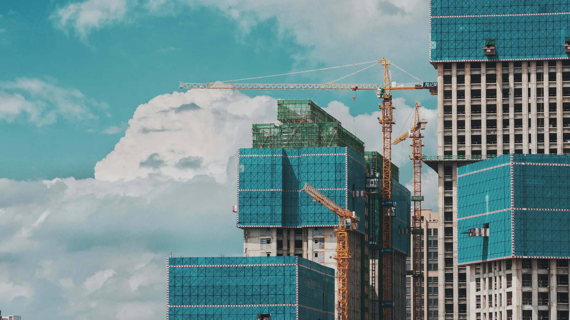 Tall Buildings Under Cloudy Sky